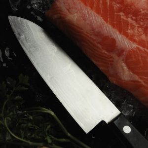 black handled knife on red textile