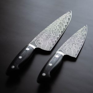 a pair of knives sitting on top of a table